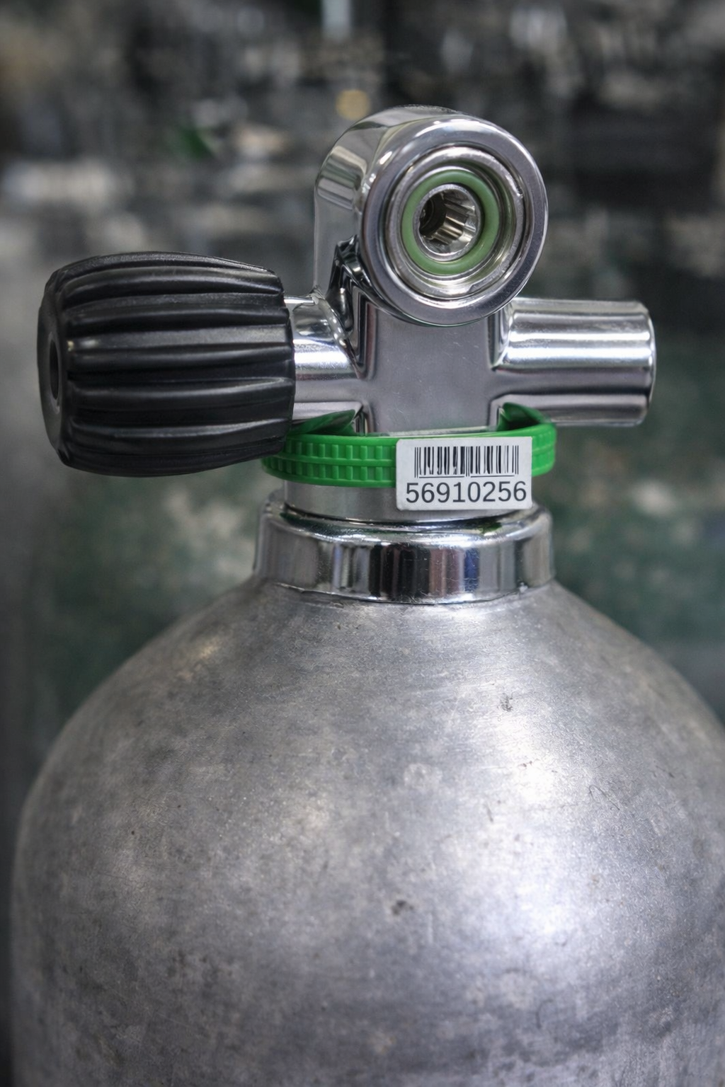 Chrome scuba tank valve with barcode zip tie around the valve neck